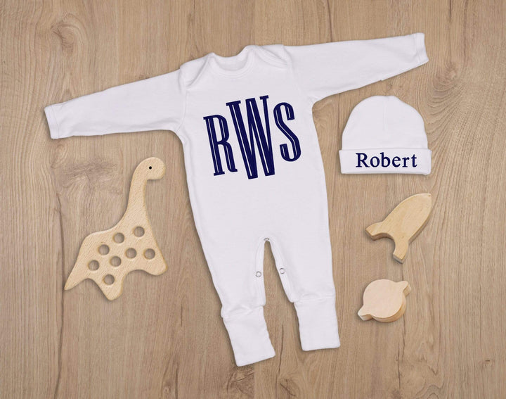white newborn coming home outfit with navy blue monogram
