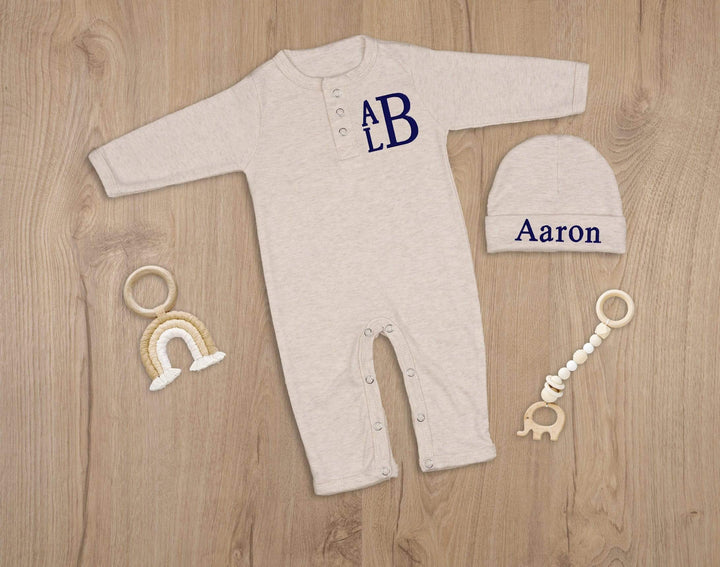 Beige newborn coming home outfit with a stacked monogram